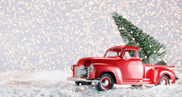 istock Christmas tree on red toy car trunk 1352052816