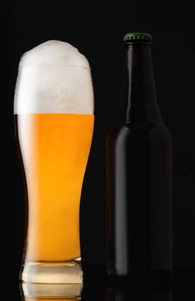 istock mug full of beer with a brown bottle 1352053758