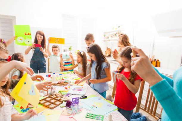 istock Rear View Of People Sitting On Table 1352054012
