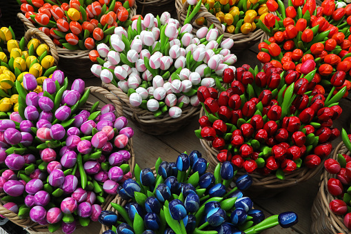 Bunches of fake tulips on sale at flowers floating market of Amsterdam, Holland