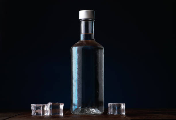 istock bottle of vodka with ice cubes 1352055372