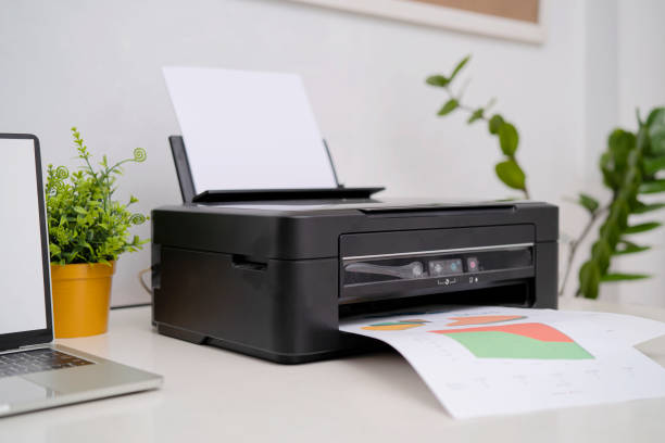 istock Printers and laptop computers are placed on the desk. 1352056512