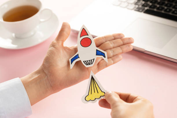 istock Business Person with Startup Rocket 1352058016