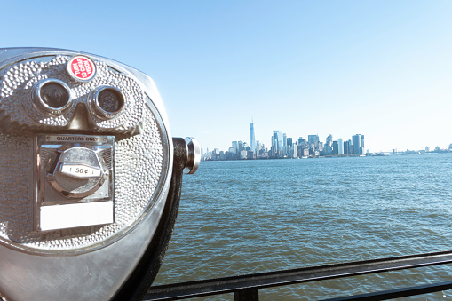 Binocular and view of Manhattan in the background.