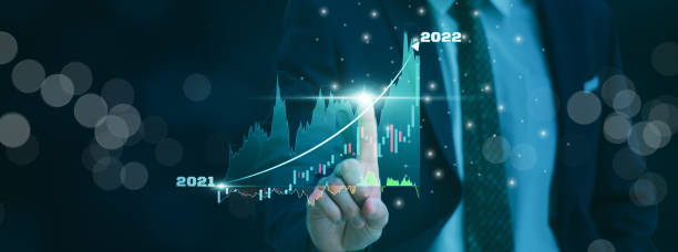 istock Businessman using finger touch symbol stock graph and chart background,concept growth and market business investment,stock marketing and strategy making financial plan and high market development 1352064454