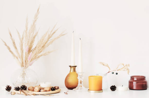 istock autumn home decorations with burning candles 1352065679
