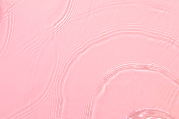 istock pink transparent clear water surface texture summer background 1352065932