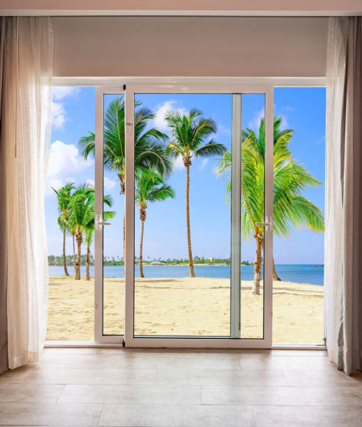 istock large glass door overlooking the beach 1352067015