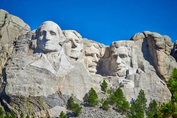 Photo of Mount Rushmore National Monument with clear blue skies in South Dakota.