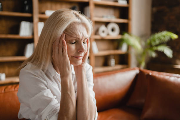 istock Psychologist appointment. Stressed sad tired exhausted caucasian middle-aged mature businesswoman freelancer with headache migraine thinking about family marriage work problems at work office 1352067816