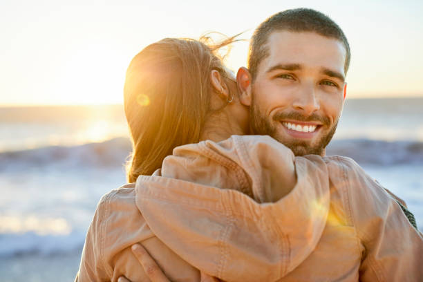 istock Couple at beach on sunny day 1352067888