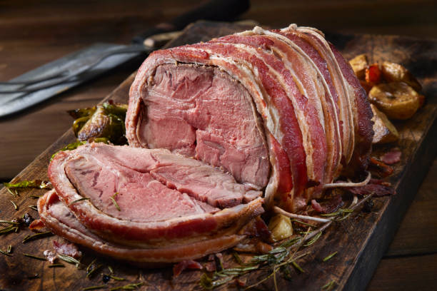 istock Medium Rare, Bacon Wrapped Pork Roast Dinner 1352069196