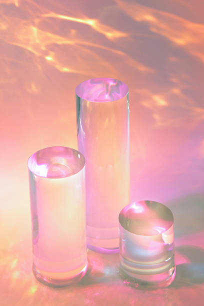 istock three clear glass cylinder podiums on pastel pink background 1352069579