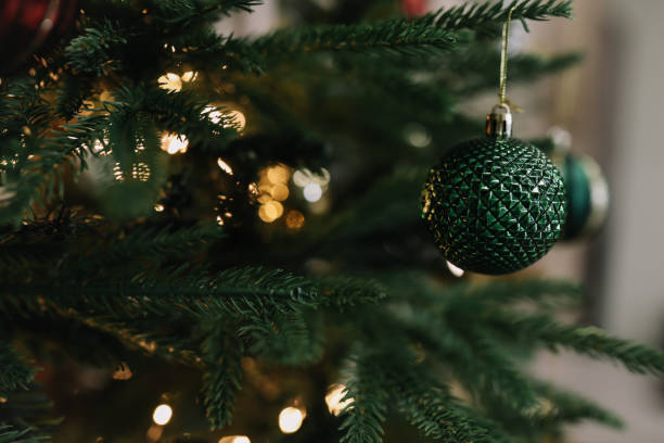 istock New Year 2022 background. Sparkling Christmas tree with balls and decorations 1352069944
