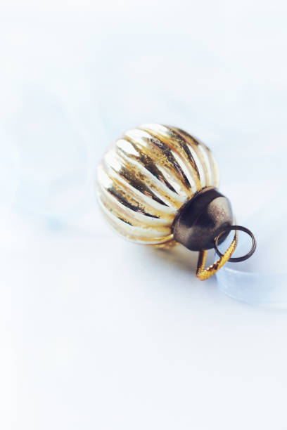 istock Christmas golden bauble on bright background. Close up. Copy space. 1352070957
