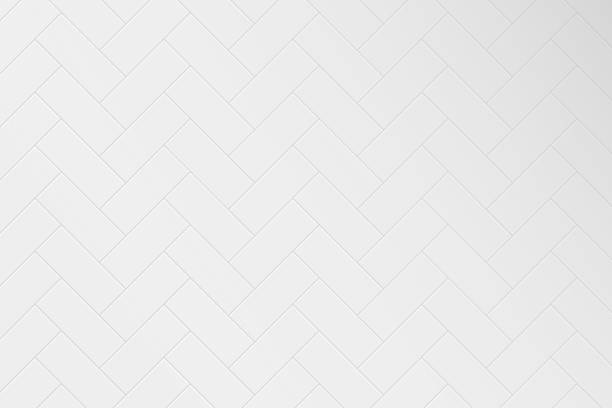 White herringbone tile wall or floor. Herringbone pattern of ceramic tiled grid for bathroom, kitchen or toilet interior. Realistic 3d rectangle tile with shadow. Vector White herringbone tile wall or floor. Herringbone pattern of ceramic tiled grid for bathroom, kitchen or toilet interior. Realistic 3d rectangle tile with shadow. Vector illustration. bathroom backgrounds stock illustrations