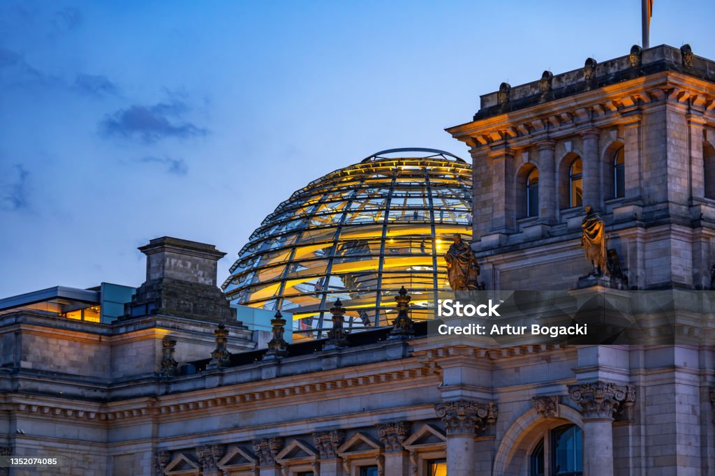 The Reichstag Dome At Dusk In Berlin Dome of the Reichstag building at dusk in city of Berlin, Germany. Berlin Stock Photo