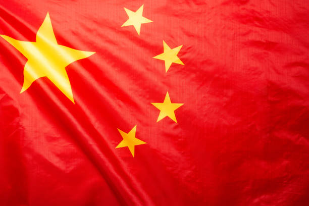 istock China flag waving as a background. 1352074383