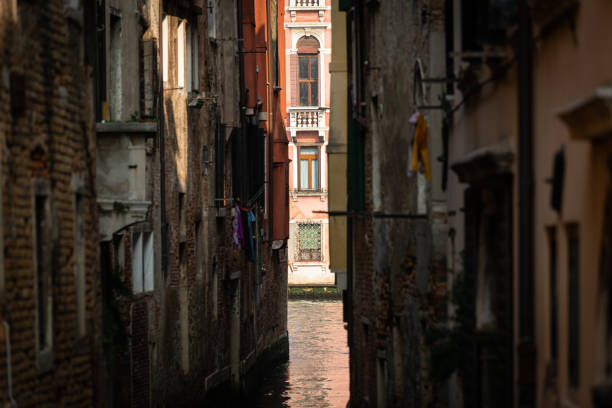 Narrow canal in Venice Narrow canal in Venice (Italy) on a sunny day in autumn, palace at canale grande in background venice italy grand canal honeymoon gondola stock pictures, royalty-free photos & images