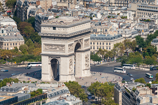 Aerial view over Paris from Eiffel Tower, sunny day in summer, Arc de Triomphe