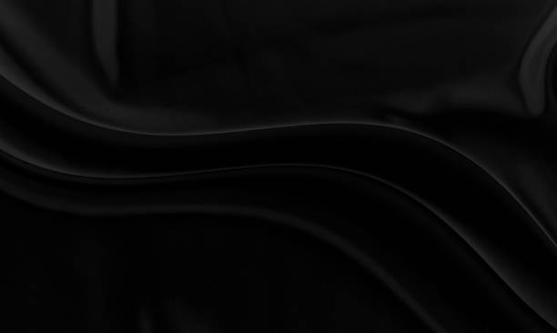 istock Black gray satin dark fabric texture luxurious shiny that is abstract silk cloth background with patterns soft waves blur beautiful. 1352078358