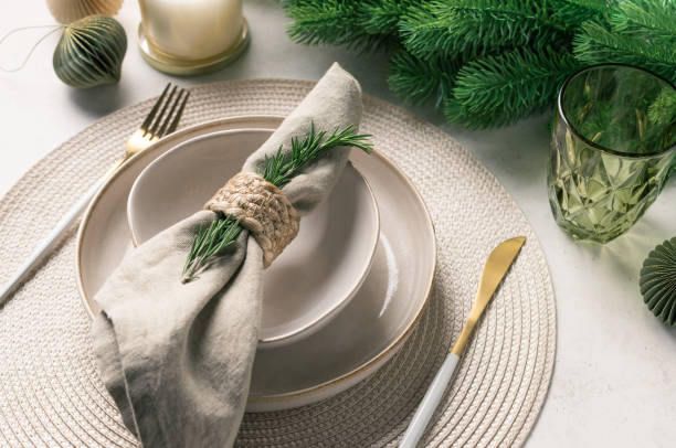 istock Christmas festive table setting with ceramic plate, linen napkin, cutlery 1352079017