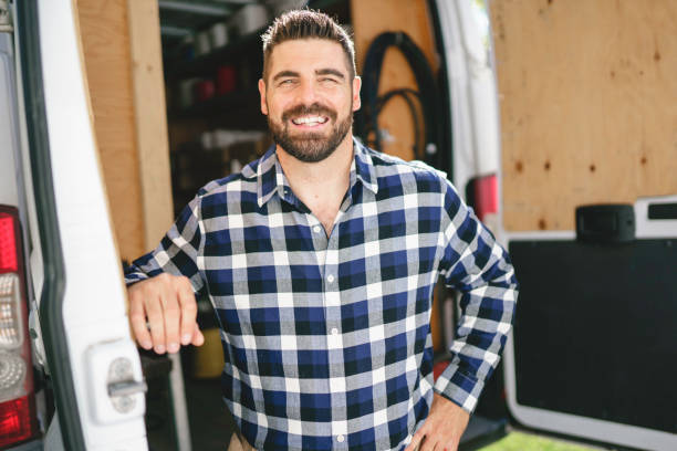 istock Portrait of an electrician happy worker at work 1352079956