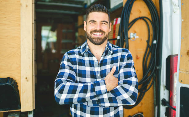 istock Portrait of an electrician happy worker at work 1352079968