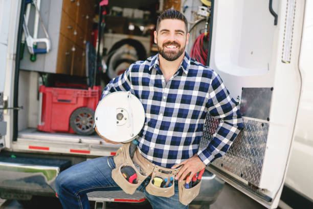 istock Portrait of an electrician happy worker at work 1352079971
