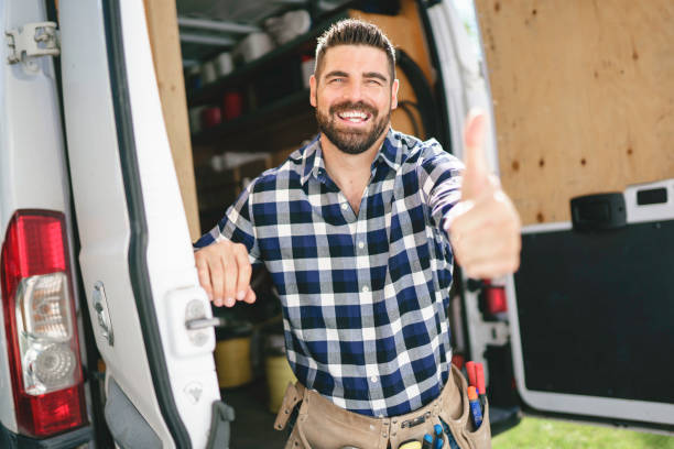 istock Portrait of an electrician happy worker at work 1352079972