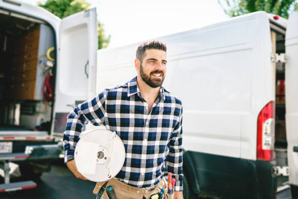 istock Portrait of an electrician happy worker at work 1352080011