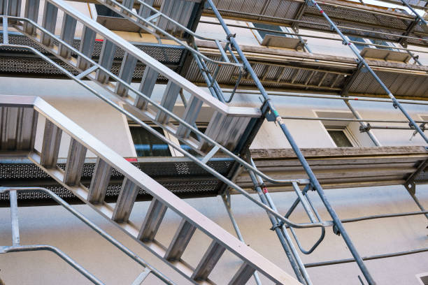 istock Frame of metal scaffolding on a building under construction. 1352080038