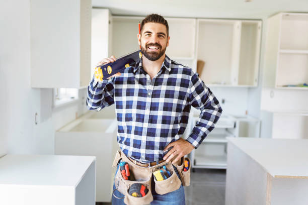 istock Concentrated young man work with white cabinet in the kitchen 1352080147