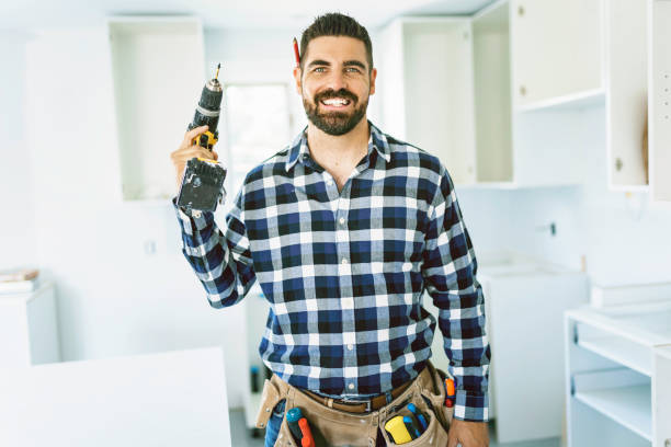 istock Concentrated young man work with white cabinet in the kitchen 1352080172