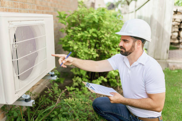 istock man with a white hard hat holding a clipboard, inspect house thermopump 1352080447