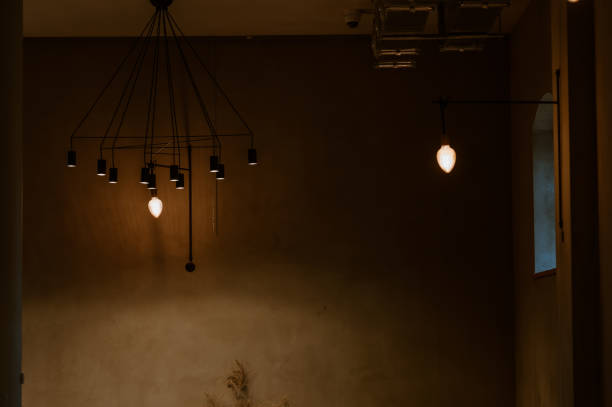 istock lamp turned on in a dark room 1352081991