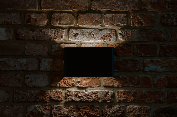 istock lamp turned on in a dark room 1352082046