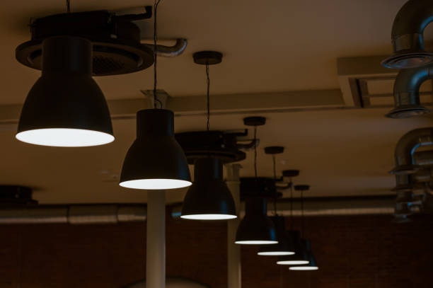 istock lamp turned on in a dark room 1352082066