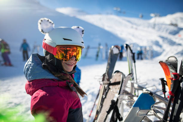 Teenage girl standing by ski stands at glacier in the Alps Teenage girl is skiing at glacier in the Alps. Teenage girl is standing by the ski stand.
Sunny winter day.
Nikon D850 apres ski stock pictures, royalty-free photos & images