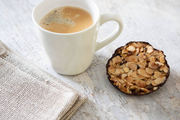 Cup of morning coffee with apple pie and pink rose