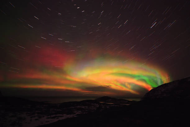 istock Colorful Aurora Borealis in the night sky. Stars trails on digitally generated image 1352084165