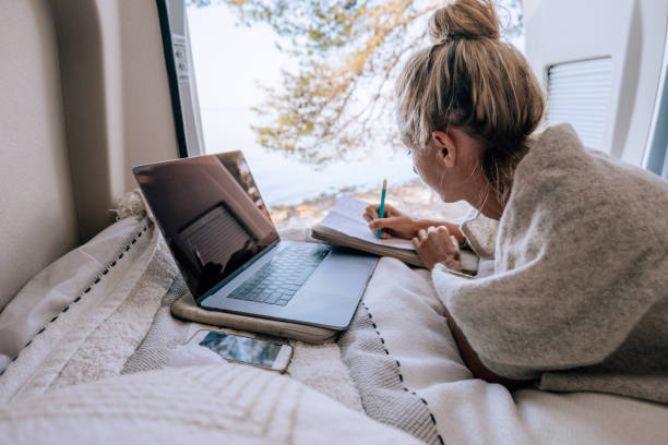 istock Female digital nomad enjoys the van life 1352085390