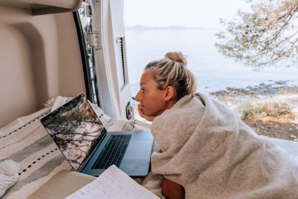 istock Woman working online from her Campervan 1352085947