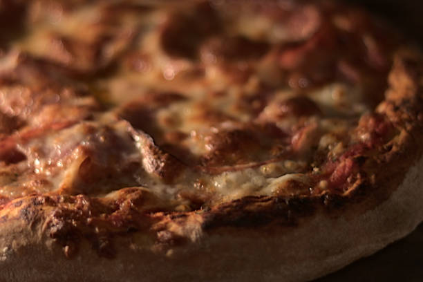 istock Fresh oven baked homemade pizza on pizza stone 1352086440