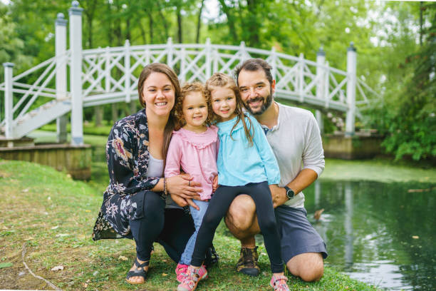 istock nice family having fun in summer forest 1352089491