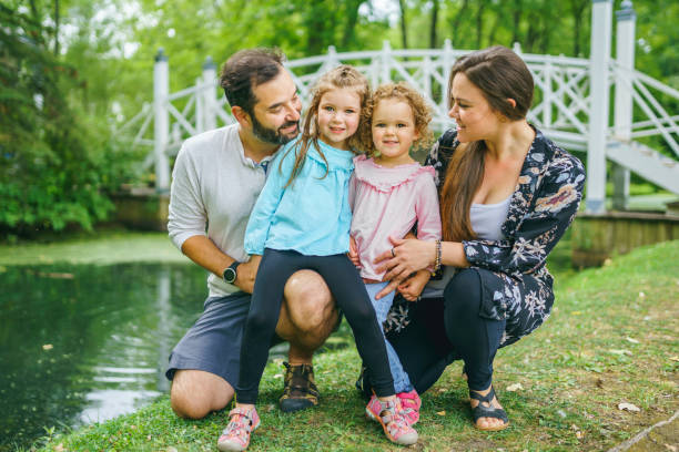 istock nice family having fun in summer forest 1352089496