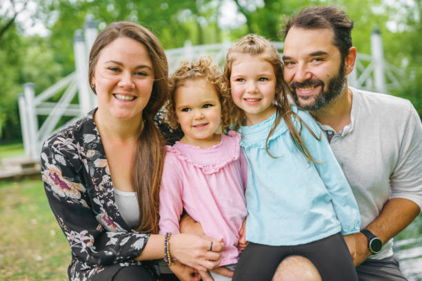 istock nice family having fun in summer forest 1352089497