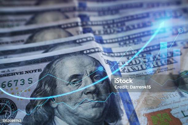 Business And Finance With One Hundred Dollar Bills With Bull Market Arrow Graph High Quality Stock Photo - Download Image Now