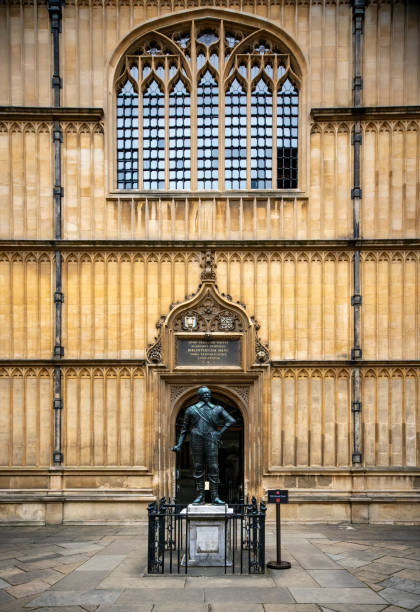 The Bodleian Library with sign in the foreground The famous Bodleian Library building in Oxford, Oxfordshire, England, UK, with a statue of William Herbert, 3rd Earl of Pembroke, in the foreground and the entrance in the background. earl of pembroke stock pictures, royalty-free photos & images