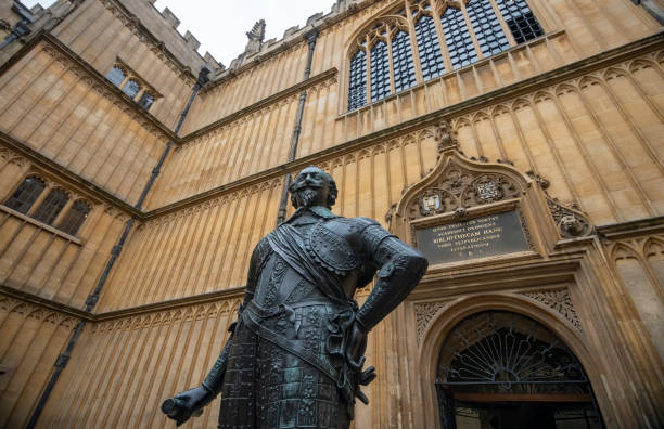 The Bodleian Library with sign in the foreground The famous Bodleian Library building in Oxford, Oxfordshire, England, UK, with a statue of William Herbert, 3rd Earl of Pembroke, in the foreground and the entrance in the background. earl of pembroke stock pictures, royalty-free photos & images